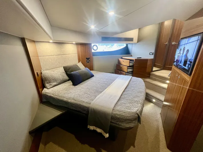  Yacht Photos Pics Luxurious bedroom interior of 2020 Maritimo M51 yacht with modern furnishings and ambient lighting.