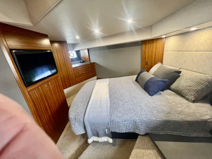  Yacht Photos Pics Luxurious bedroom in 2020 Maritimo M51 yacht with cozy bedding and modern wood finishes.