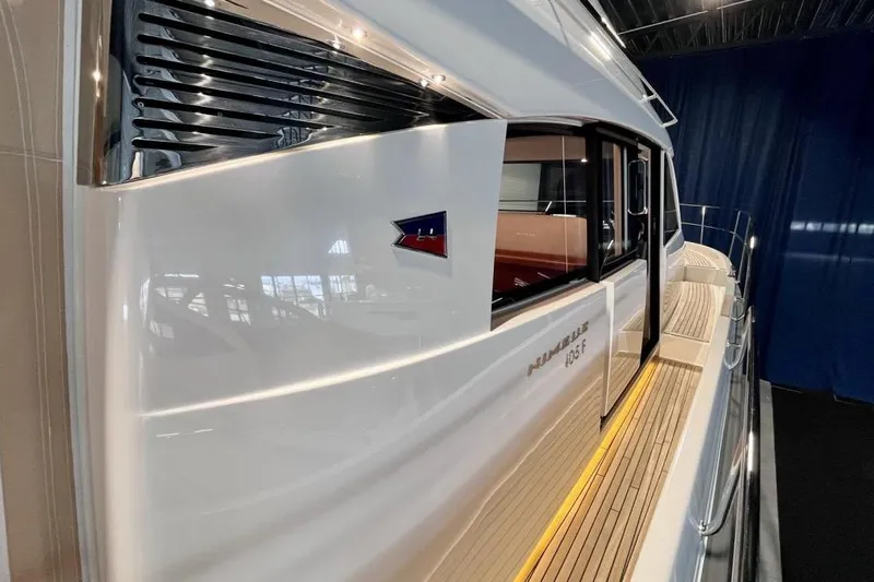 Yacht Photos Pics 2023 Nimbus 405 Flybridge yacht, sleek design with polished exterior and wooden deck.