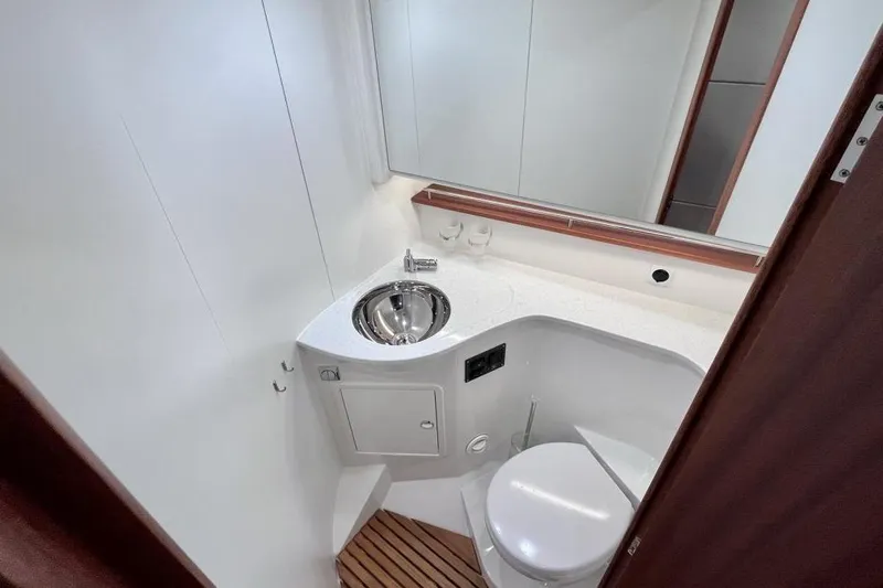  Yacht Photos Pics Modern bathroom in 2023 Nimbus 405 Flybridge yacht with sleek sink and toilet.