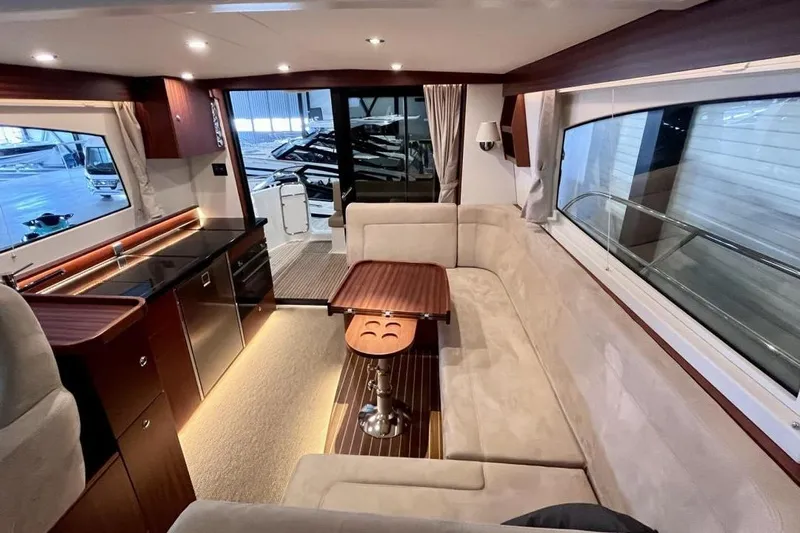  Yacht Photos Pics Luxurious interior of 2023 Nimbus 405 Flybridge yacht with elegant seating and modern kitchen.