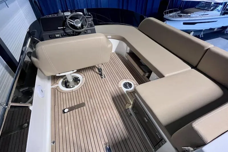  Yacht Photos Pics 2023 Nimbus 405 Flybridge interior with beige seating and modern helm