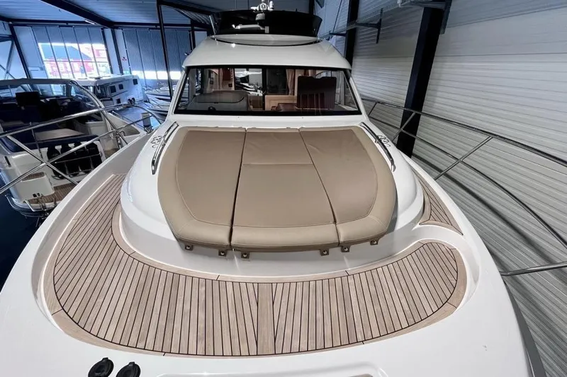  Yacht Photos Pics 2023 Nimbus 405 Flybridge yacht with sleek design and spacious deck in showroom.