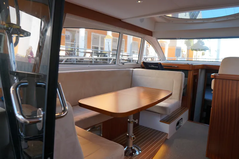  Yacht Photos Pics Luxurious interior of 2023 Nimbus 405 Flybridge yacht with elegant seating.