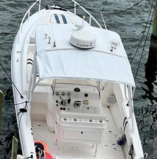 Galore Yacht Photos Pics 2006 Intrepid 323 Cuddy boat with Garmin equipment docked on water.