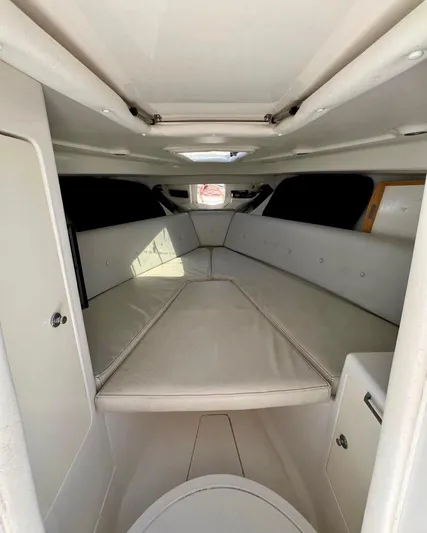 Galore Yacht Photos Pics 2006 Intrepid 323 Cuddy cabin interior with cushioned seating and storage.