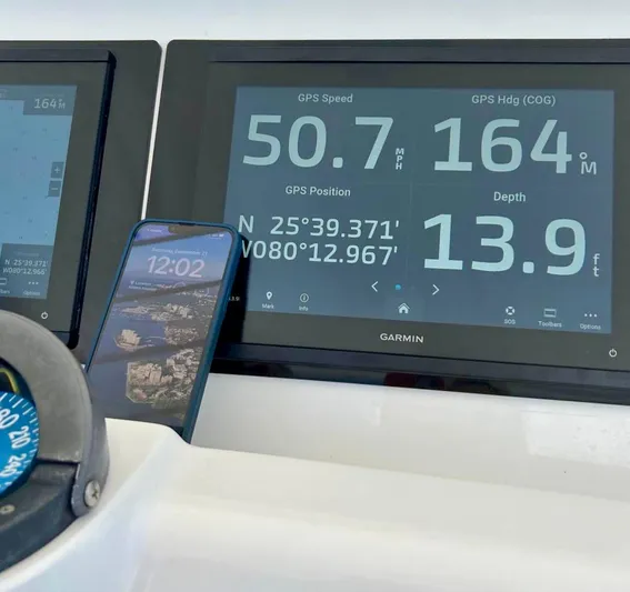 Galore Yacht Photos Pics Garmin GPS display on 2006 Intrepid 323 Cuddy showing speed, heading, and depth.