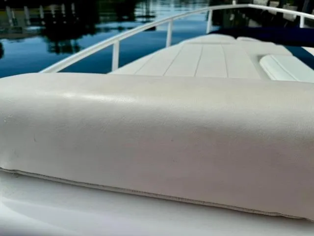 Galore Yacht Photos Pics Close-up of 2006 Intrepid 323 Cuddy boat's cushioned seating on deck.