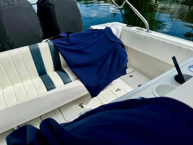 Galore Yacht Photos Pics 2006 Intrepid 323 Cuddy boat interior with seating and blue cover.