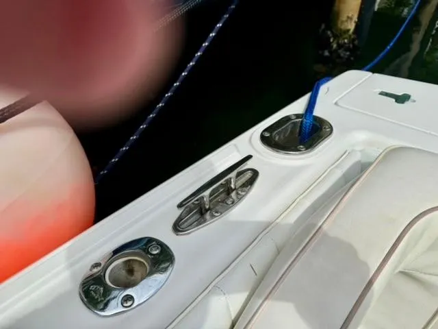 Galore Yacht Photos Pics Close-up of 2006 Intrepid 323 Cuddy boat deck with cleat and rope.