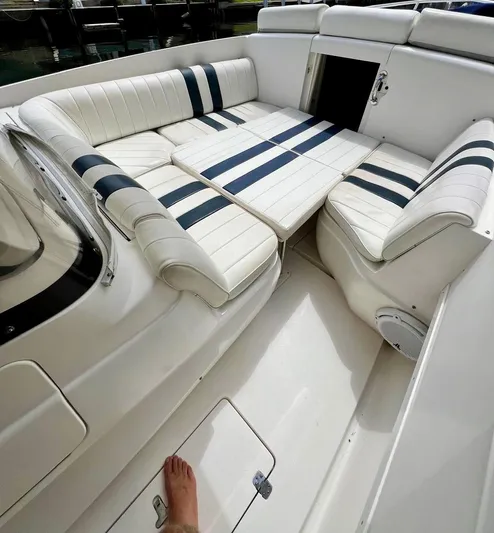 Galore Yacht Photos Pics 2006 Intrepid 323 Cuddy boat interior with white and blue striped seating.