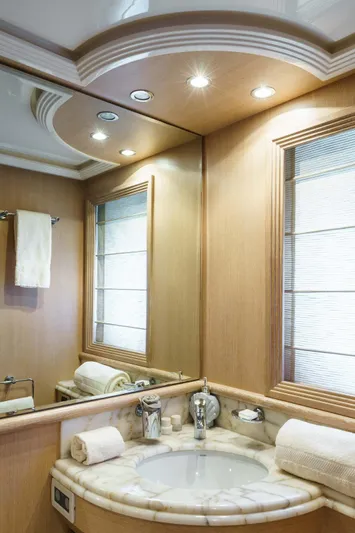 Allie Yacht Photos Pics Luxurious bathroom interior on 2008 Alalunga Open 85 Sport X yacht, featuring elegant fixtures and lighting.