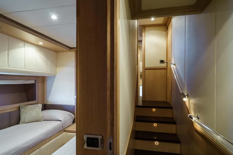 Allie Yacht Photos Pics Luxurious interior of 2008 Alalunga Open 85 Sport X yacht with cozy cabin and staircase.