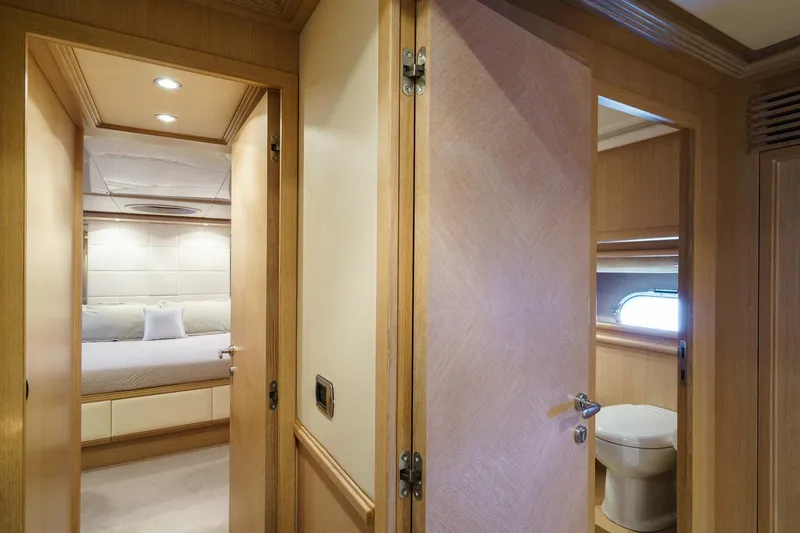 Allie Yacht Photos Pics Interior of 2008 Alalunga Open 85 Sport X yacht, featuring bedroom and bathroom.