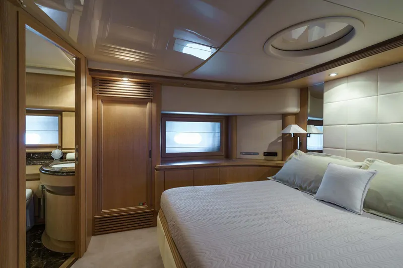 Allie Yacht Photos Pics Luxurious bedroom interior of 2008 Alalunga Open 85 Sport X yacht.