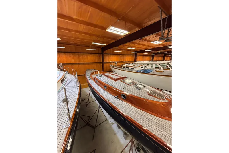 Bamboozle Yacht Photos Pics 2010 Spirit Yachts R46 sailboat in indoor storage, showcasing elegant wooden deck design.