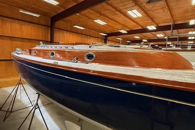 Bamboozle Yacht Photos Pics 2010 Spirit Yachts R46 sailboat with wooden deck, displayed indoors.