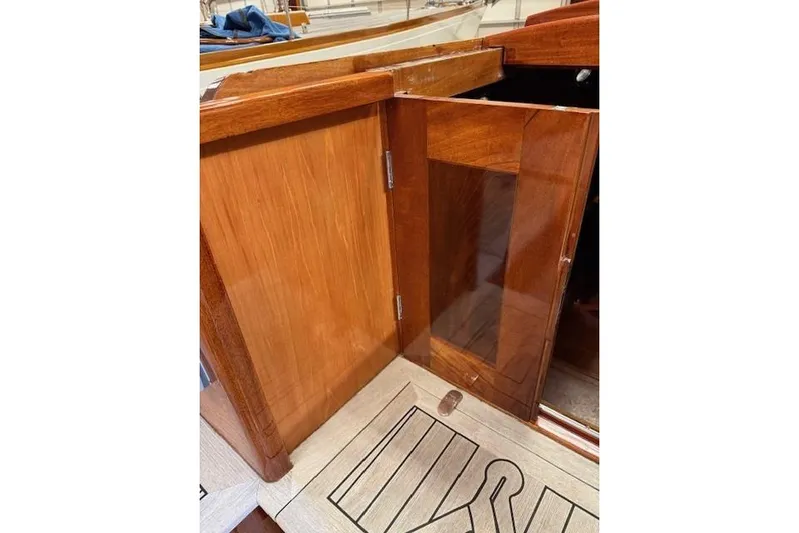 Bamboozle Yacht Photos Pics Wooden interior of 2010 Spirit Yachts R46, featuring polished cabinetry and flooring.