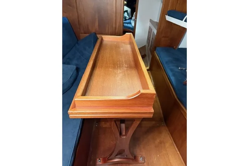 Bamboozle Yacht Photos Pics Luxurious wooden interior of 2010 Spirit Yachts R46, featuring elegant table and seating.