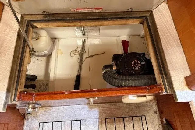 Bamboozle Yacht Photos Pics Engine compartment of 2010 Spirit Yachts R46, showing mechanical components and tools.