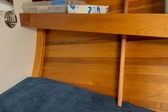 Bamboozle Yacht Photos Pics Interior of 2010 Spirit Yachts R46, featuring wooden paneling and a blue cushion.