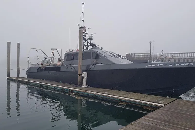 Interceptor Yacht Photos Pics River Hawk 73 Sea Stryker Fast Patrol Boat, 2012, docked in foggy harbor.