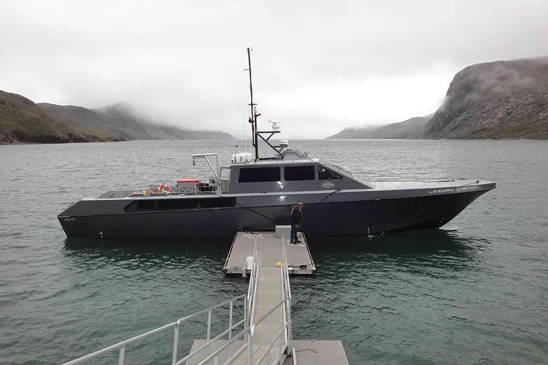 Interceptor Yacht Photos Pics River Hawk 73 Sea Stryker Fast Patrol Boat, 2012, docked in scenic coastal waters.