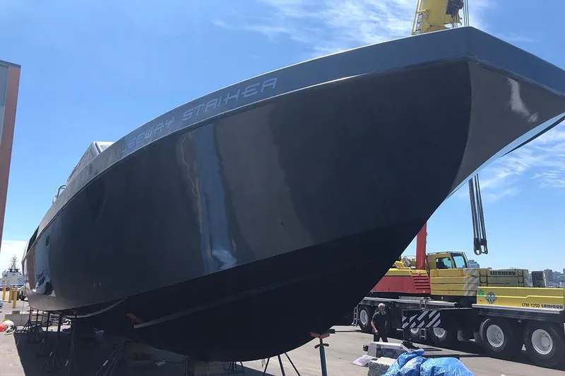 Interceptor Yacht Photos Pics River Hawk 73 Sea Stryker Fast Patrol Boat, 2012 model, docked for maintenance.