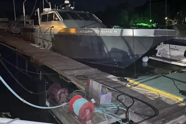 Interceptor Yacht Photos Pics Riverhawk 73 Sea Stryker Fast Patrol Boat docked at night, 2012 model.