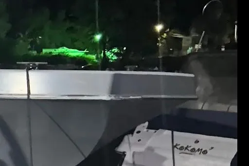 Interceptor Yacht Photos Pics Riverhawk 73 Sea Stryker Fast Patrol Boat, 2012 model, docked at night.