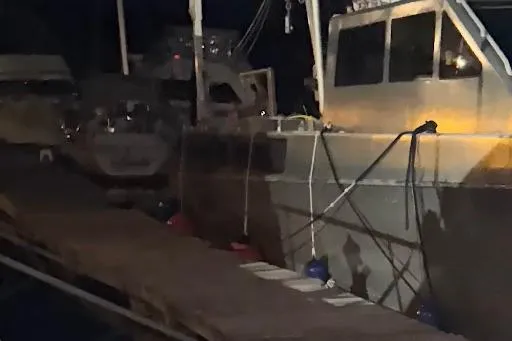 Interceptor Yacht Photos Pics 2012 Riverhawk 73 Sea Stryker Fast Patrol Boat docked at night.