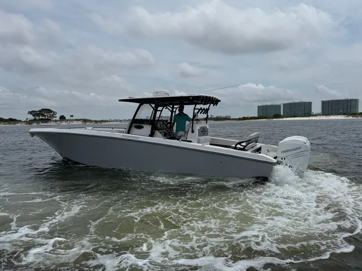  Yacht Photos Pics 2022 Fountain 38TE boat cruising on water under cloudy skies.