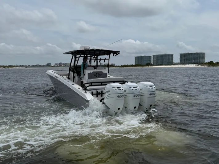  Yacht Photos Pics Fountain 38TE boat with triple 400 engines cruising on water, 2022 model.