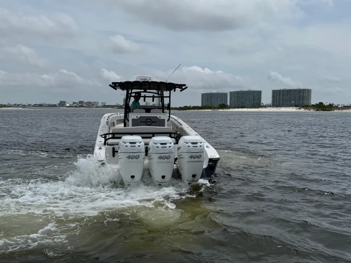  Yacht Photos Pics 2022 Fountain 38TE boat with triple 400 engines cruising on water.