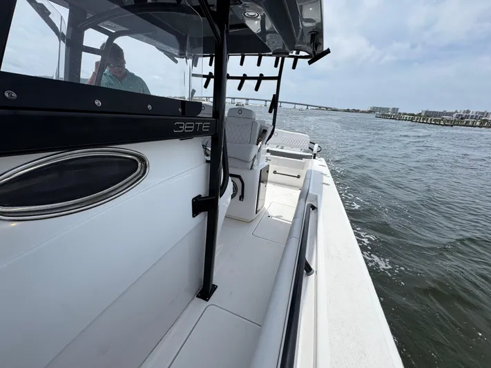  Yacht Photos Pics 2022 Fountain 38TE boat on water, featuring sleek design and spacious deck.