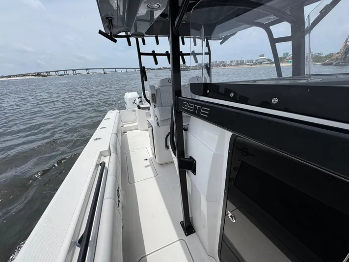  Yacht Photos Pics 2022 Fountain 38TE boat on water, showcasing sleek design and spacious deck.