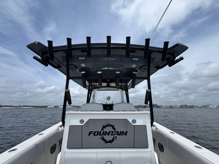  Yacht Photos Pics 2022 Fountain 38TE boat on water, featuring sleek design and spacious deck.