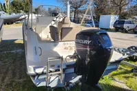 2016 Quicksilver Activ 605 Open boat with Mercury engine, parked outdoors.