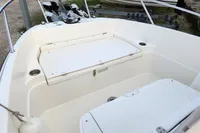 2016 Quicksilver Activ 605 Open boat interior with seating and storage compartments.