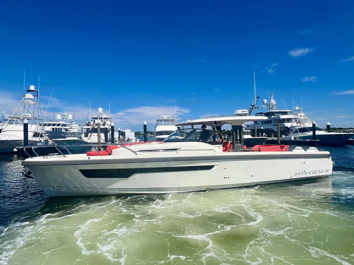 Fla#98 Yacht Photos Pics Nimbus T11 #98 TRADE! 2022 boat in marina, clear sky, calm water.