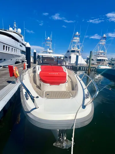 Fla#98 Yacht Photos Pics Nimbus T11 #98 TRADE! 2022 boat docked at marina, clear sky, luxury yachts in background.