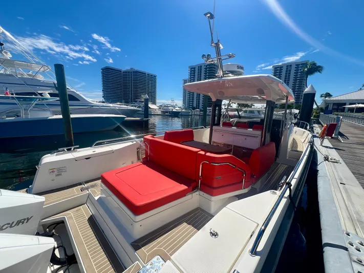 Fla#98 Yacht Photos Pics 2022 Nimbus T11 #98 TRADE! boat with red seating docked at marina.