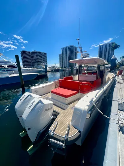 Fla#98 Yacht Photos Pics 2022 Nimbus T11 #98 TRADE! boat docked with twin outboard engines and red seating.
