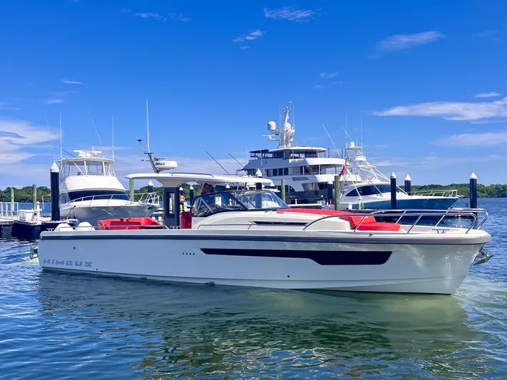 Fla#98 Yacht Photos Pics Nimbus T11 #98 TRADE! 2022 boat docked with yachts in the background.