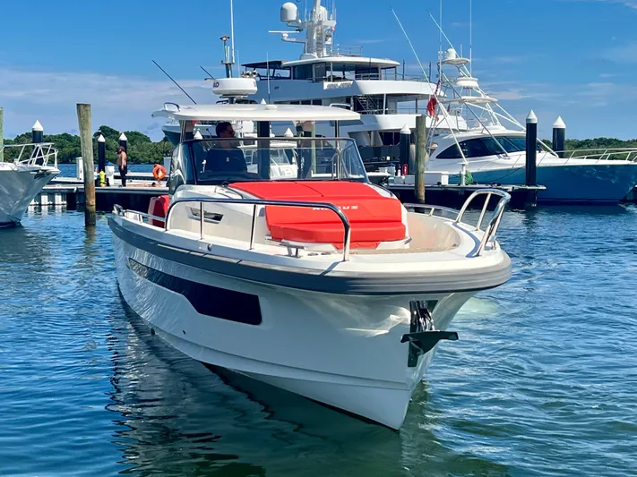 Fla#98 Yacht Photos Pics Nimbus T11 #98 TRADE! 2022 boat docked in marina, clear blue sky.