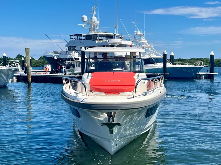Fla#98 Yacht Photos Pics Nimbus T11 #98 TRADE! 2022 boat docked in marina, clear blue sky.