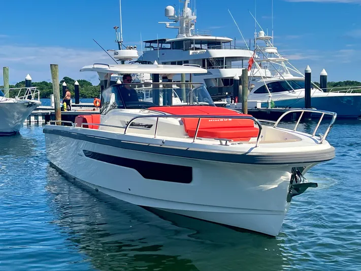 Fla#98 Yacht Photos Pics Nimbus T11 #98 TRADE! 2022 boat docked in marina with yachts in background.