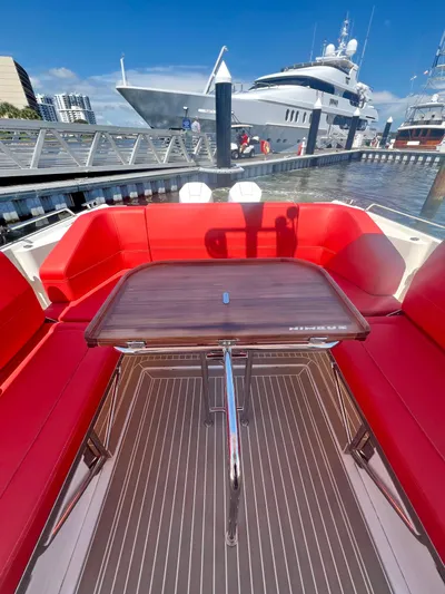 Fla#98 Yacht Photos Pics Nimbus T11 #98 TRADE! 2022 boat with red seating and wooden table at marina.