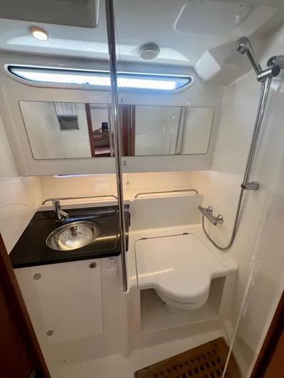Fla#98 Yacht Photos Pics Compact boat bathroom with shower, sink, and toilet in Nimbus T11 #98 TRADE!, 2022 model.