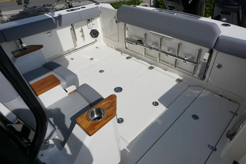 Bwce0497i324 Yacht Photos Pics 2024 Boston Whaler 360 Outrage boat interior with seating and cup holders.